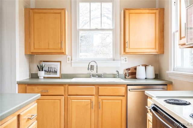 kitchen with dishwasher, light brown cabinetry, a sink, and light countertops