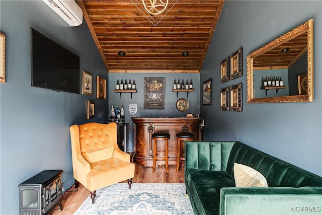 living area with a wall mounted AC, wood finished floors, lofted ceiling, wood ceiling, and a dry bar