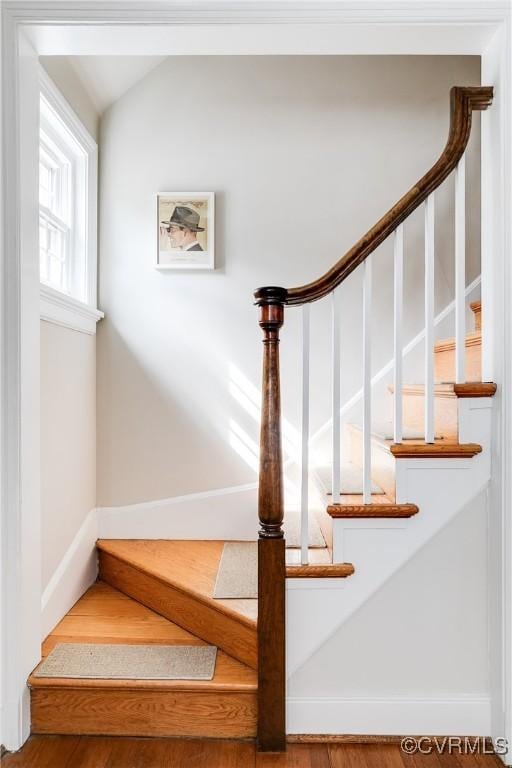 stairs with vaulted ceiling