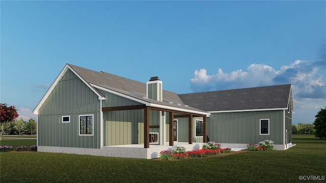 back of property featuring board and batten siding, a yard, and a chimney