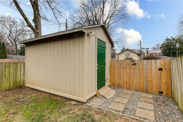 view of shed with a fenced backyard