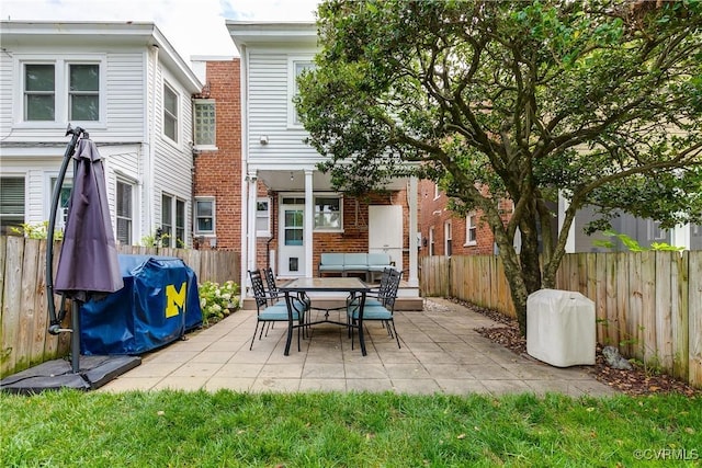 view of patio / terrace featuring a grill and a fenced backyard