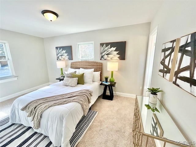 bedroom with carpet flooring and baseboards