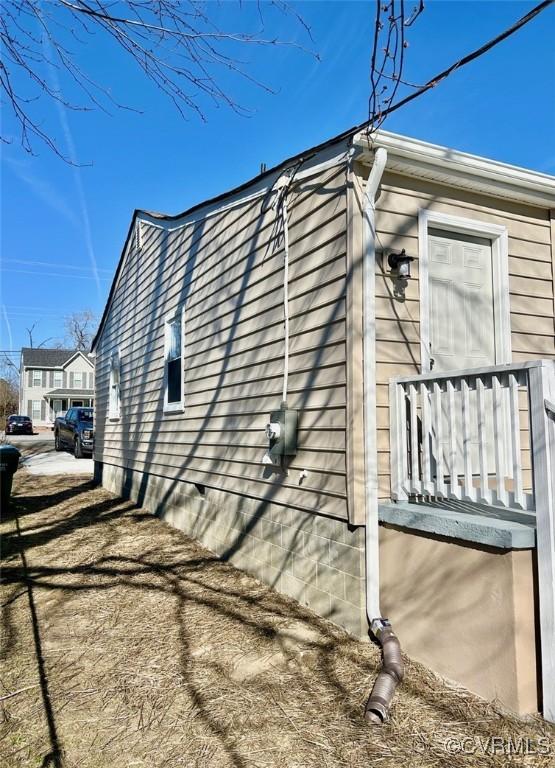 view of home's exterior with crawl space