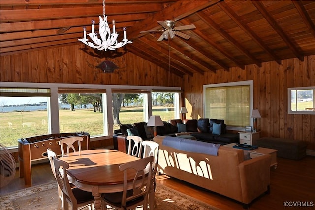 interior space featuring lofted ceiling with beams, an inviting chandelier, wood ceiling, wood walls, and wood finished floors