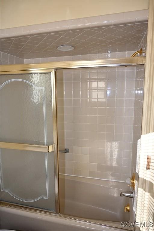 full bathroom with shower / bath combination with glass door