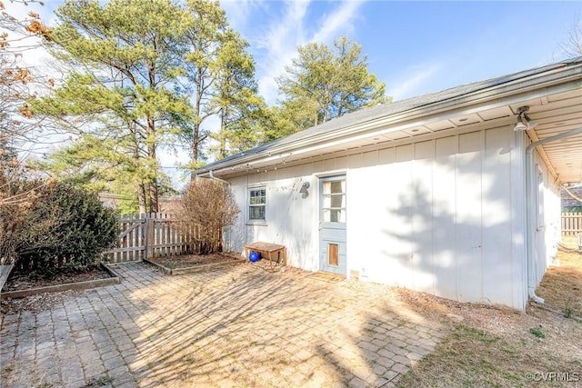 exterior space featuring fence and a patio