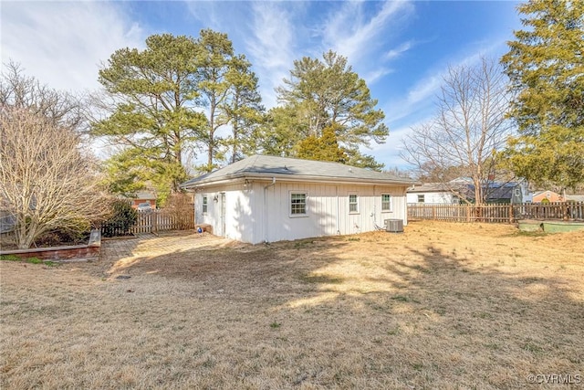 exterior space with central AC unit and fence