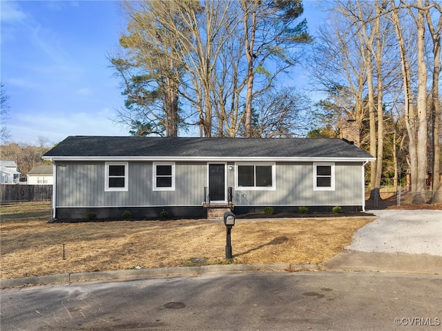 view of front of house with fence