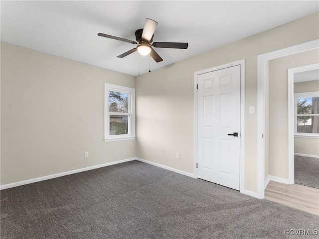 unfurnished bedroom with carpet, baseboards, and ceiling fan