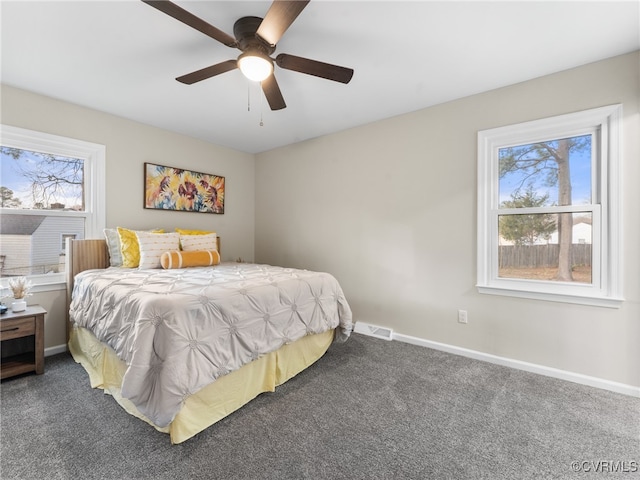 bedroom featuring visible vents, carpet, baseboards, and ceiling fan