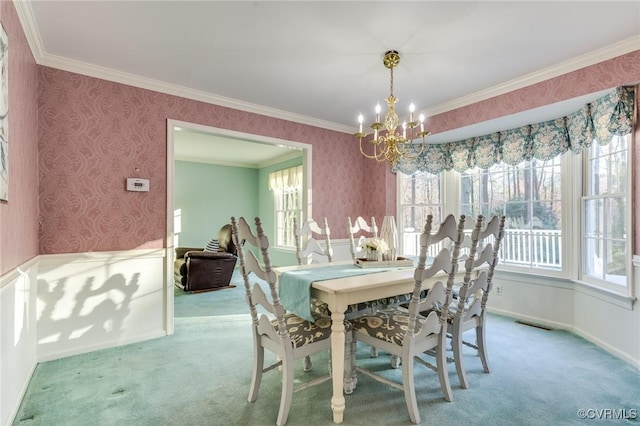 dining room featuring wallpapered walls, carpet, a chandelier, and crown molding