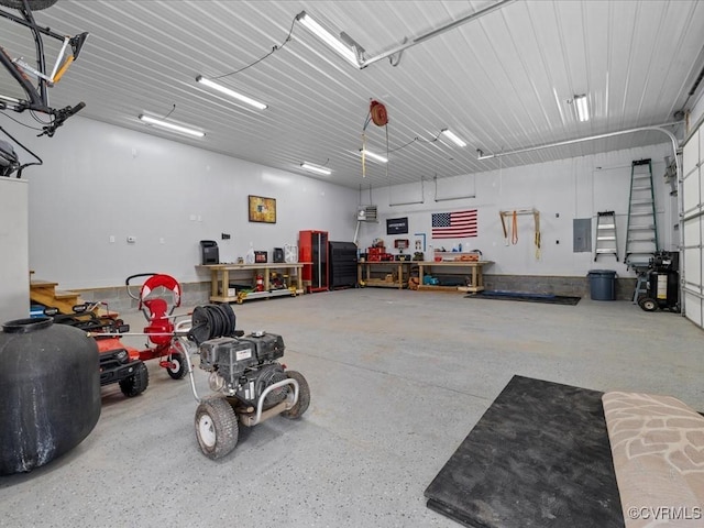 garage featuring a workshop area and electric panel