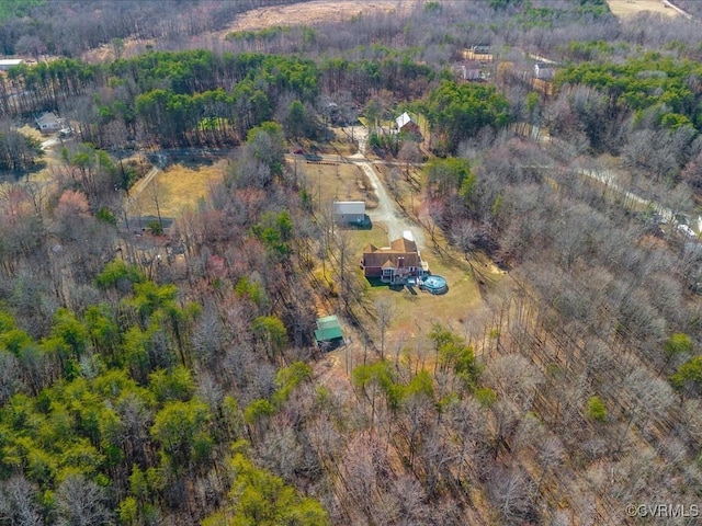 bird's eye view featuring a forest view