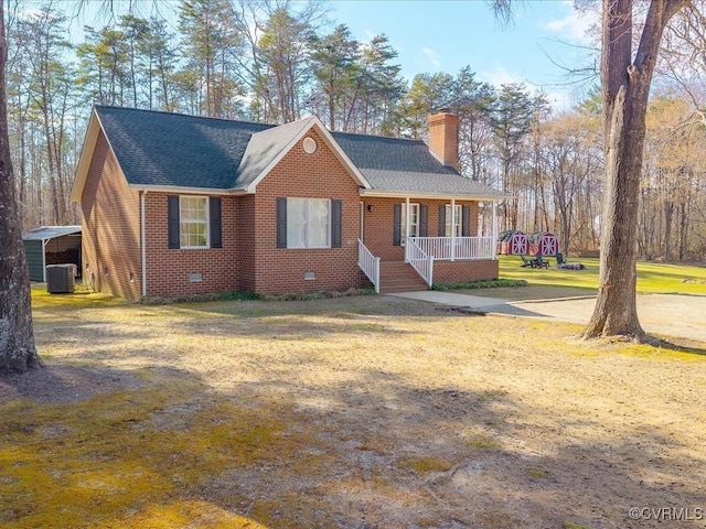 ranch-style home featuring a chimney, crawl space, cooling unit, a porch, and brick siding