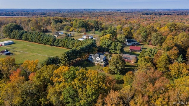 birds eye view of property with a wooded view