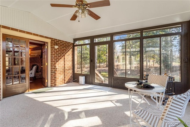 sunroom / solarium featuring vaulted ceiling and ceiling fan