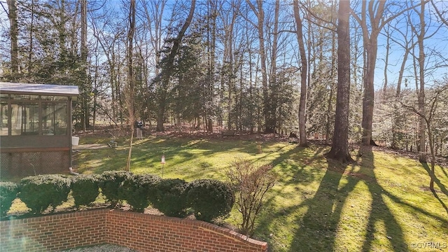 view of yard featuring a sunroom