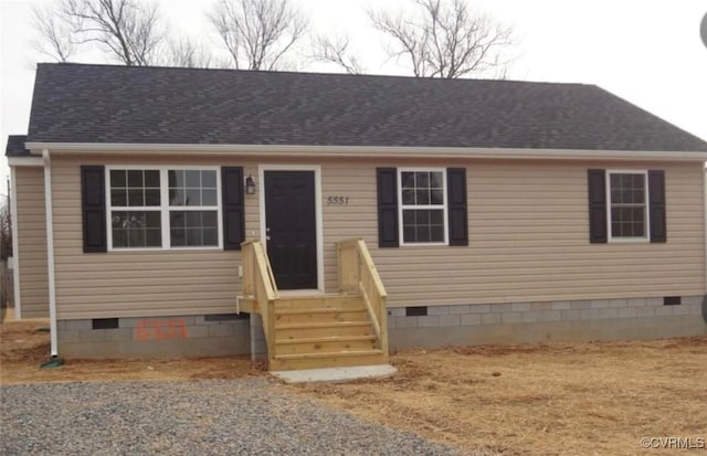 view of front of home featuring a shingled roof and crawl space