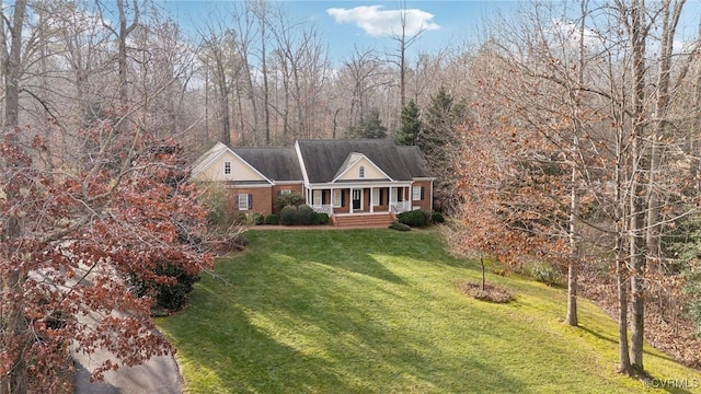 view of front of house featuring a porch and a front yard