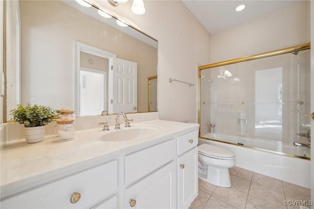 full bathroom featuring toilet, shower / bath combination with glass door, tile patterned flooring, and vanity