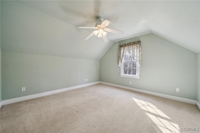 bonus room featuring lofted ceiling, ceiling fan, baseboards, and carpet flooring