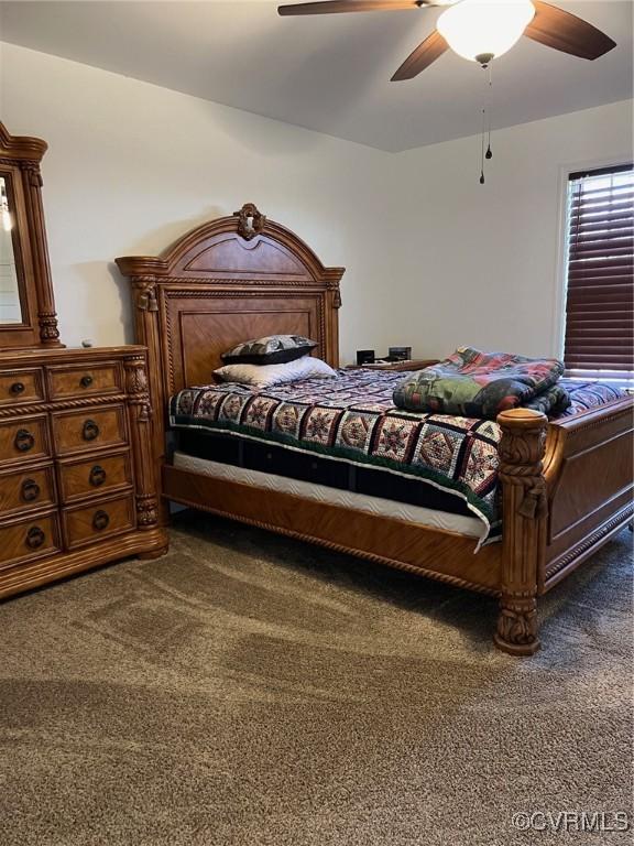 bedroom featuring a ceiling fan and carpet floors