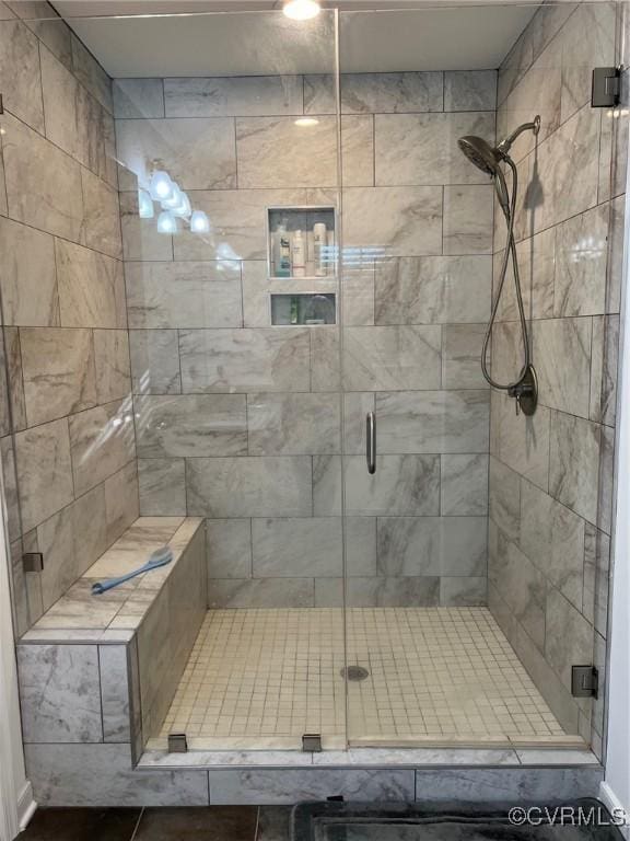 bathroom with a shower stall