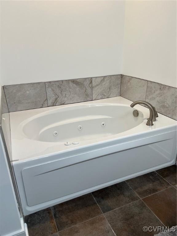 full bathroom featuring tile patterned floors and a jetted tub