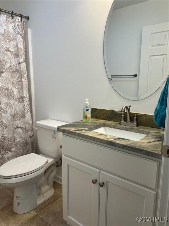 full bath featuring tile patterned floors, toilet, and vanity