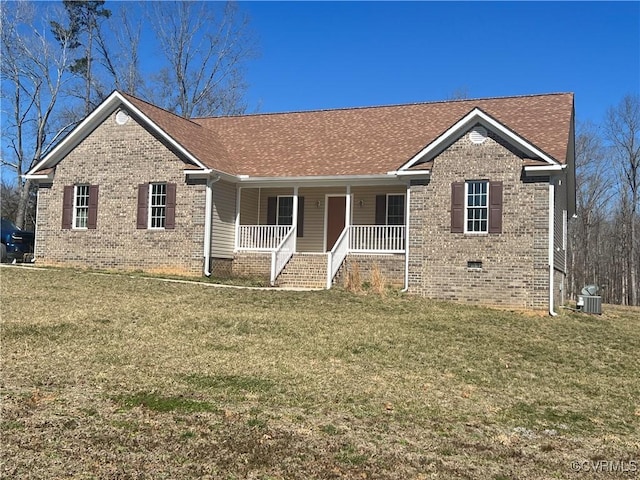 ranch-style house featuring crawl space, brick siding, covered porch, and a front yard