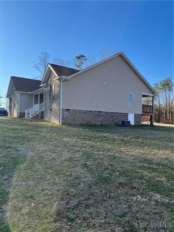 view of property exterior with crawl space and a yard