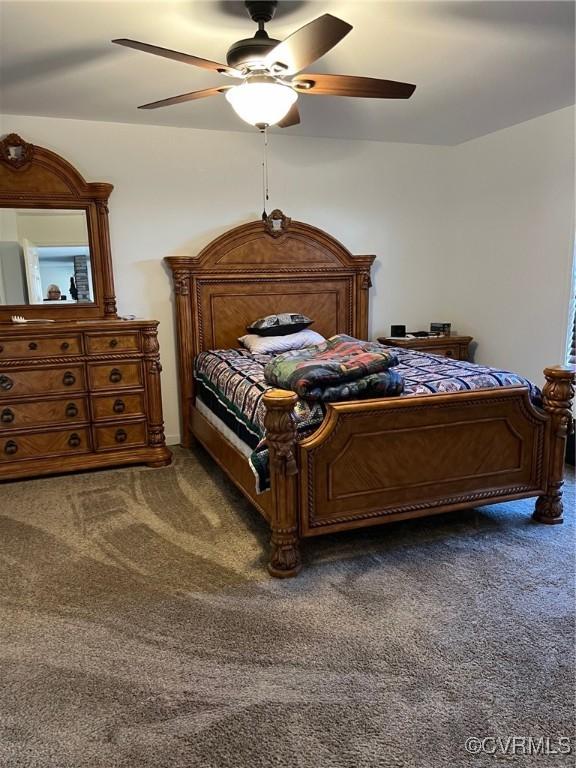 bedroom with carpet floors and a ceiling fan