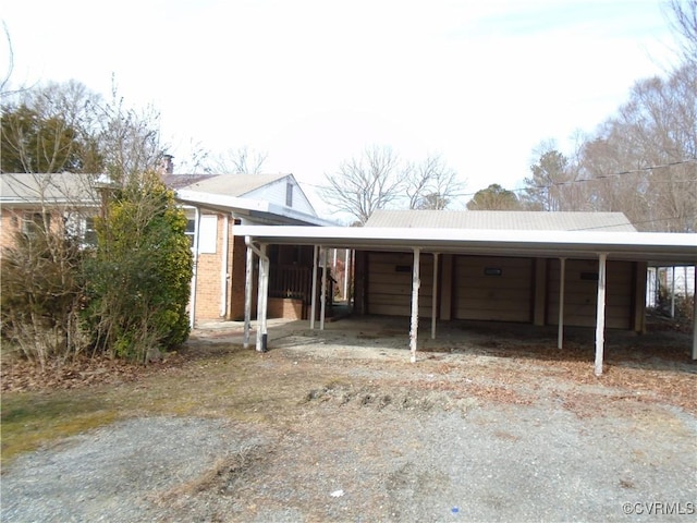 view of front of home with a detached garage