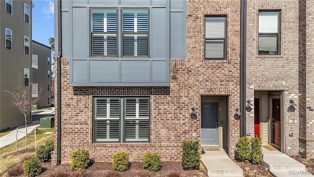 view of front of home featuring brick siding