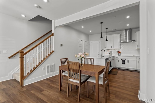 dining area with dark wood-style floors, stairway, visible vents, and recessed lighting