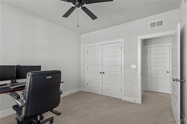 office area featuring a ceiling fan, carpet, visible vents, and baseboards