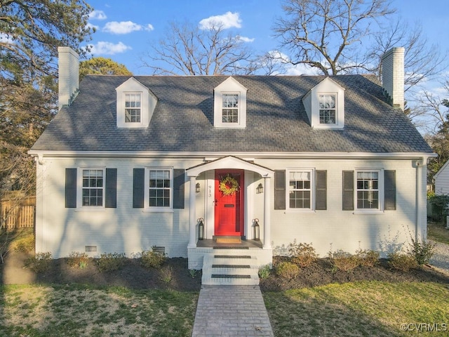 cape cod-style house featuring crawl space, a chimney, fence, and brick siding