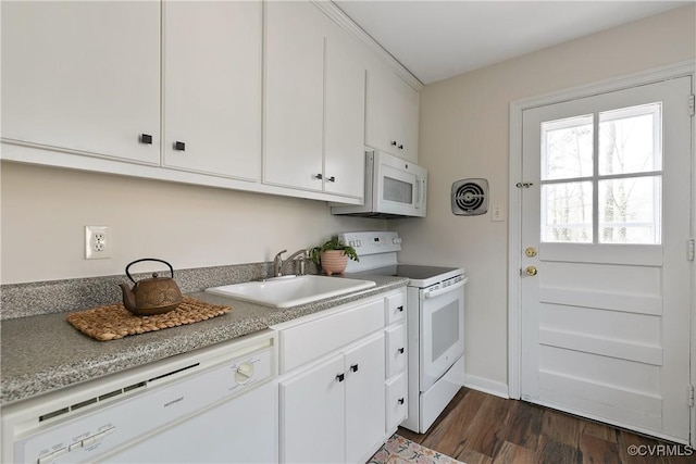 kitchen featuring white appliances, visible vents, dark wood-style flooring, white cabinetry, and a sink