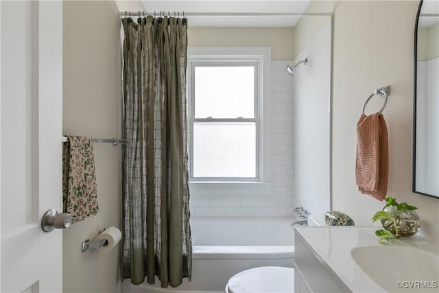 bathroom featuring shower / bath combination with curtain, vanity, and toilet