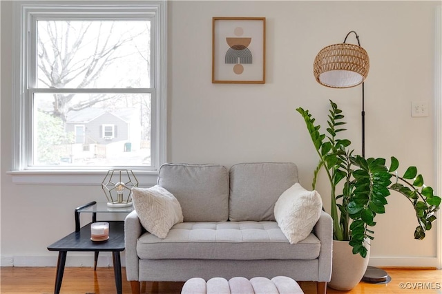 living room featuring wood finished floors and baseboards