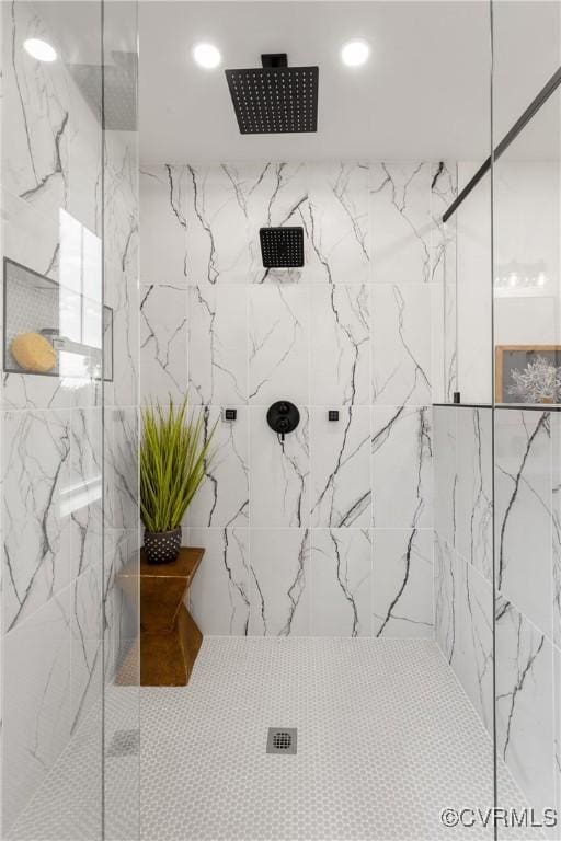 bathroom with a marble finish shower