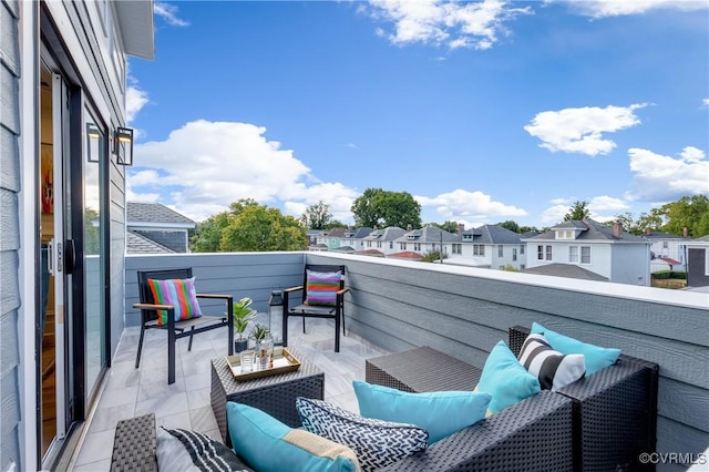 balcony with a residential view and an outdoor living space