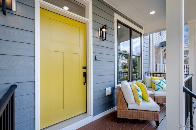 view of exterior entry with covered porch