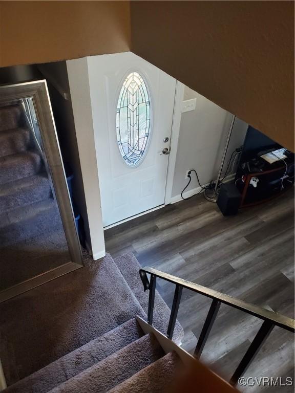 foyer with stairs and wood finished floors