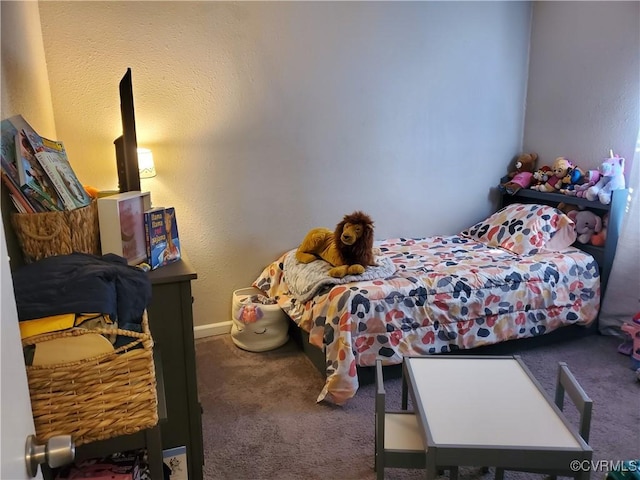 bedroom featuring baseboards and carpet floors