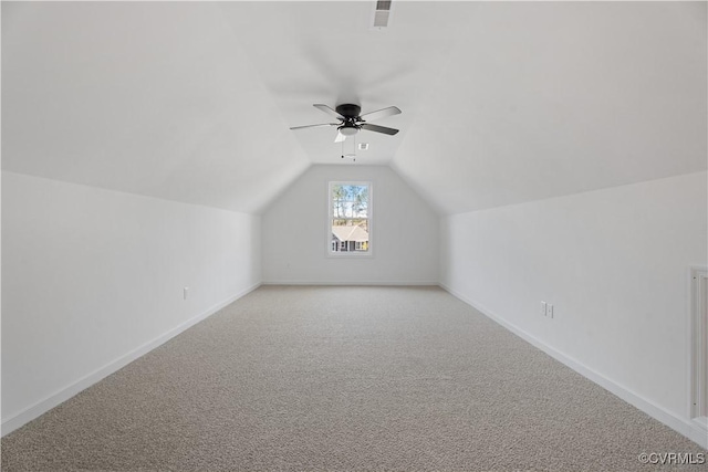 11777 Pine Needles Dr, New Kent, VA 23140 - bonus room featuring a ceiling fan, light carpet, vaulted ceiling, and baseboards