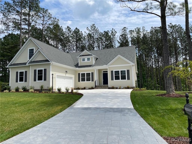 11777 Pine Needles Dr, New Kent, VA 23140 - view of front of property with concrete driveway, a front yard, a garage, and roof with shingles
