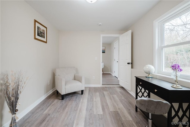 sitting room with light wood-style floors and baseboards