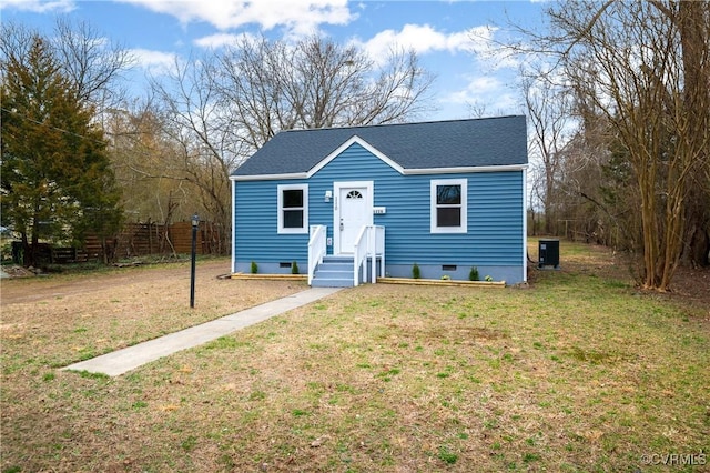 bungalow-style house with central AC, crawl space, a front yard, and roof with shingles